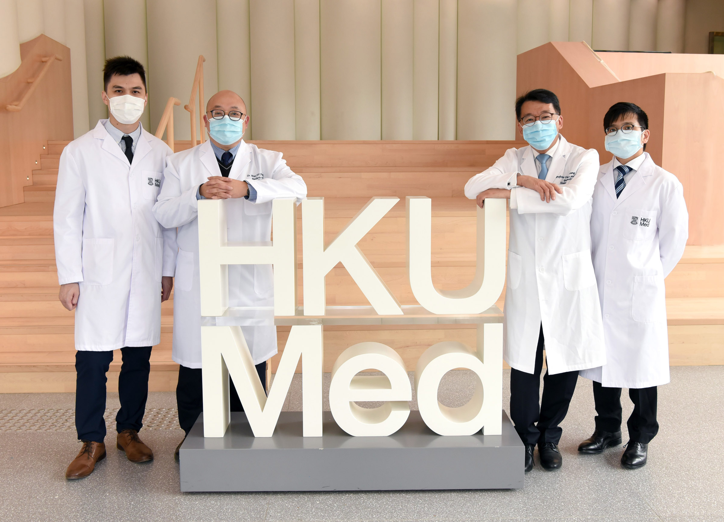 The research team in the lobby of the HKUMed building. Members include: Dr Christopher Mak, Dr Brian Chung, Professor Cheung Yiu-fai, and Dr Yeung Kit-san.