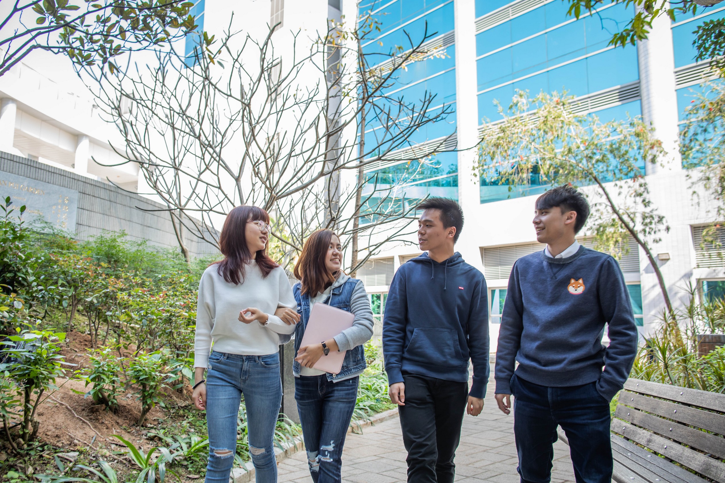 Group of students having a walk in Fan Pui Garden at medical campus.