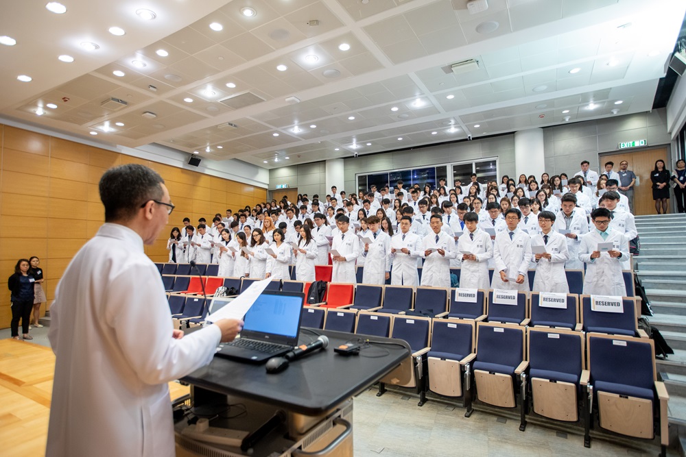 Medical students taking the oath at the White Coat Ceremony.