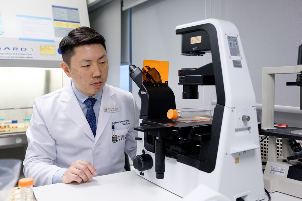 Professor Ivan Hung using an experiment apparatus.