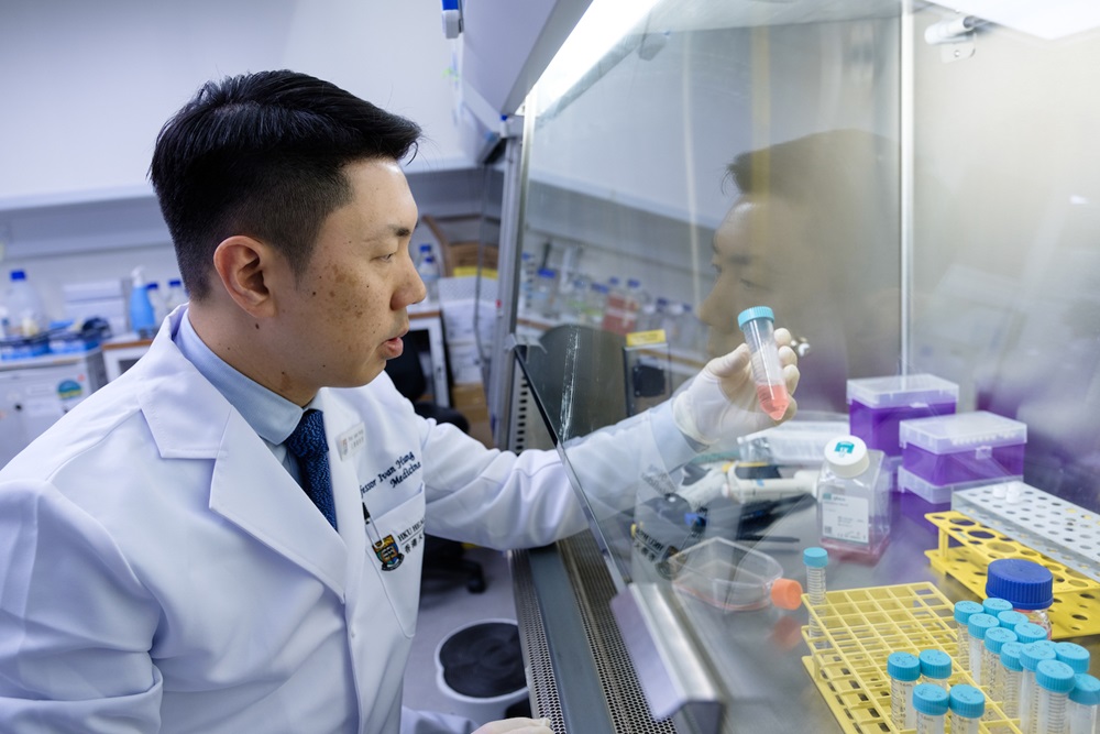 Professor Ivan Hung using an experiment apparatus.