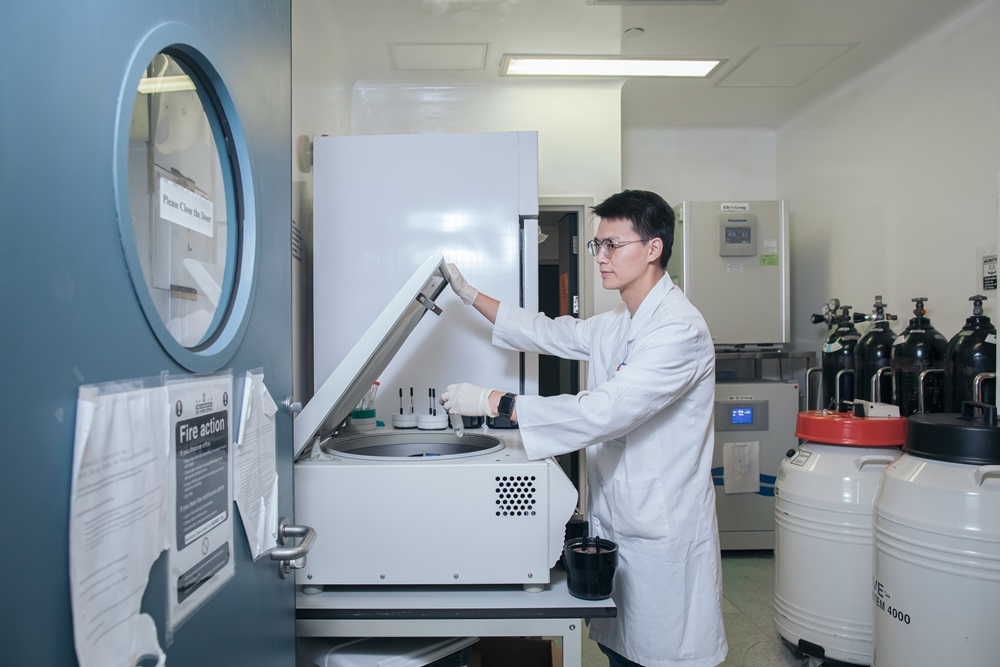 A research student working in a laboratory.