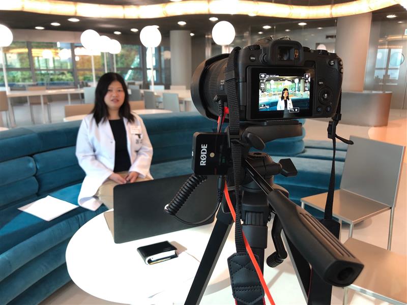 A HKUMed researcher taking a video interview.